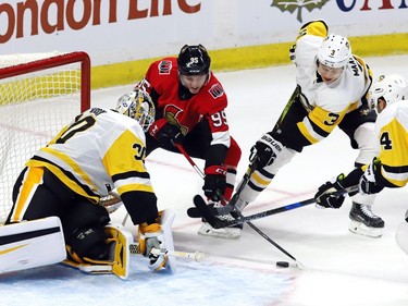 Ottawa Senators centre Matt Duchene (95) tries to get a shot on Pittsburgh Penguins goalie Matt Murray (30) as defenceman Olli Maatta (3) and defenceman Justin Schultz (4) defend.