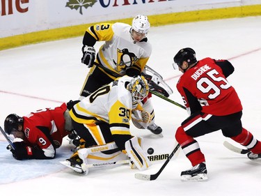 Pittsburgh Penguins goalie Matt Murray makes a save on Ottawa Senators centre Matt Duchene as Penguins defenceman Olli Maatta (3) and Ottawa Senators right wing Bobby Ryan battle.