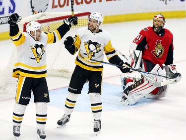 The Pittsburgh Penguins' Patric Hornqvist (72) celebrates his goal against Ottawa Senators goalie Craig Anderson (41) with teammate Riley Sheahan (15) during the second at the CTC on Thursday, Nov. 16, 2017.
