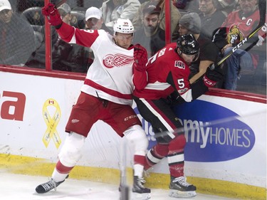 Detroit Red Wings right wing Anthony Mantha collides with Ottawa Senators defenceman Cody Ceci.