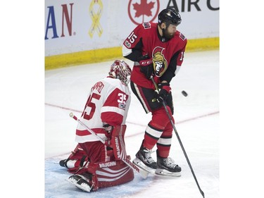 Ottawa Senators left wing Zack Smith screens Detroit Red Wings goalie Jimmy Howard on a shot.