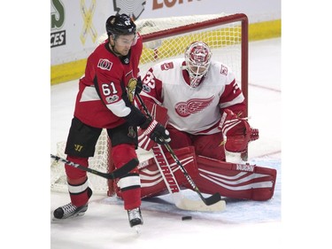Ottawa Senators right wing Mark Stone tries to deflect the puck past Detroit Red Wings goalie Jimmy Howard during the third period.