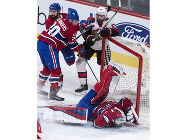 Montreal Canadiens goaltender Carey Price is knocked over by the Ottawa Senators' Nate Thompson during the first period.
