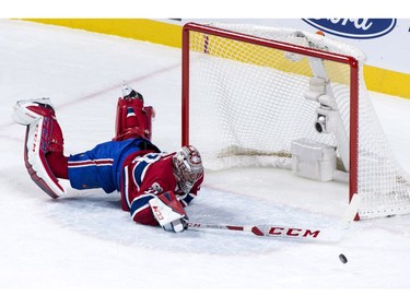 Montreal Canadiens goaltender Carey Price dives to deflect a shot in the third period against the Ottawa Senators.