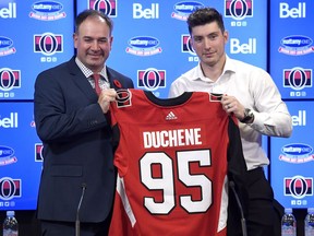 Ottawa Senators General Manager Pierre Dorion, left, and Senators centre Matt Duchene hold his new jersey after a press conference in Ottawa, Monday November 6, 2017.