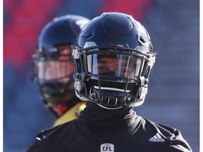 Sherrod Baltimore of the Ottawa Redblacks hiding from the cold during practice in Ottawa, November 10, 2017. Photo by Jean Levac ORG XMIT: 127941
Jean Levac, Postmedia News