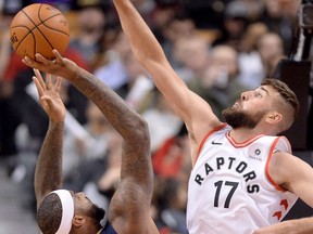 New Orleans Pelicans centre DeMarcus Cousins gets blocked by Toronto Raptors centre Jonas Valanciunas on Nov. 9, 2017