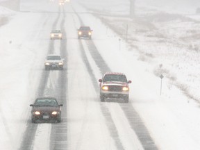 A heavy snow fall makes driving treacherous on the eastbound Queensway during a snowstorm in 2005.