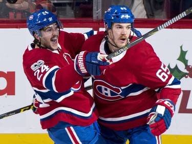 The Montreal Canadiens' Phillip Danault, left, celebrates his goal with teammate Andrew Shaw.