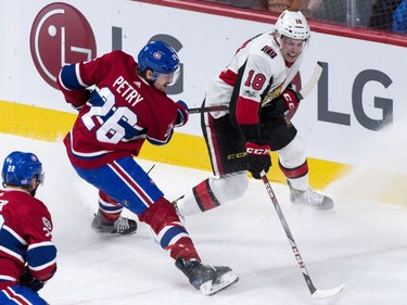 The Ottawa Senators' Ryan Dzingel battles against the Montreal Canadiens' Jeff Petry during the third period.