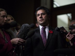 Ontario Attorney General Yasir Naqvi scrums with the media in the Queens Park Legislature in Toronto on Nov. 1. He, and corrections minister Marie-France Lalonde, have some explaining to do, write two academics.