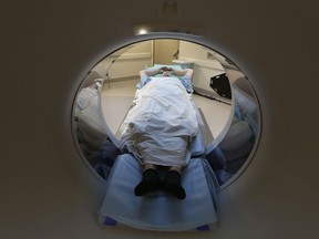 A woman laying on the Montfort Hospital's new cardiac scan machine at the Montfort Hospital in Ottawa Wednesday Nov. 1, 2017.