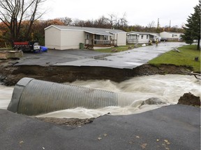 Residents of Parc de la Riviera in Gatineau had to be evacuated after a rainfall washed out the streets .