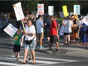 No Salvation Army In Vanier

SOS Vanier protesting on Montreal Road in Ottawa Ontario Tuesday July 18, 2017. SOS Vanier is dedicated to stopping the Salvation Army from building a shelter at 333 Montreal Road.  Tony Caldwell
Tony Caldwell