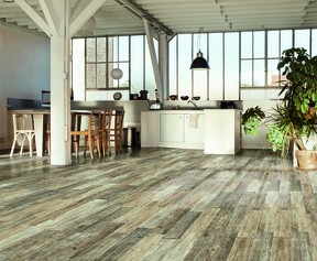 Plankwood from CIOT is a glazed porcelain stoneware that replicates the look of real wood planks while offering the convenience and durability of porcelain tiles. This product, with shading similar to wood planks, lends an amazing natural look when laid onto floors and walls.