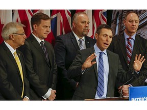 PC. leader Patrick Brown along with L-R, MPP Vic Fedeli, MPP Jeff Yurek, MPP Todd Smith and MPP John Yakabuski comment on Fraser Institute report at Queens Park in Toronto, Ont. on Wednesday, February 17, 2016. PC MPP John Yakabuski said his party, if elected to govern in next June's provincial election, would slow down the implementation of the minimum wage increases.