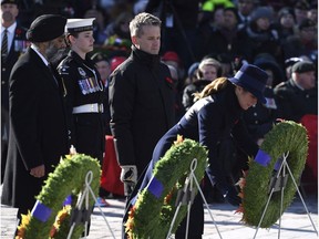 Sophie Gregoire Trudeau, Harjit Sajjan, Seamus O'Regan

Sophie Gregoire Trudeau, wife of Prime Minister Justin Trudeau, right, lays a wreath as Minister of National Defence Harjit Sajjan, left, and Minister of Veterans Affairs and Associate Minister of National Defence Seamus O'Regan look on during the National Remembrance Day Ceremony at the National War Memorial in Ottawa on Saturday, Nov. 11, 2017. THE CANADIAN PRESS/Justin Tang ORG XMIT: JDT110
Justin Tang,