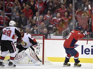 Washington Capitals left wing Alex Ovechkin (8), of Russia, celebrates his goal during the first period of an NHL hockey game as Ottawa Senators goalie Craig Anderson (41) and defenseman Johnny Oduya (29) stand near the net, Wednesday, Nov. 22, 2017, in Washington. (AP Photo/Nick Wass)