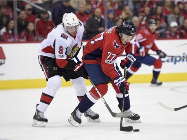Ottawa Senators right wing Bobby Ryan (9) vies for the puck against Washington Capitals right wing T.J. Oshie (77) during the first period of an NHL hockey game, Wednesday, Nov. 22, 2017, in Washington.