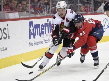Washington Capitals centre Jay Beagle (83) vies for the puck Ottawa Senators right wing Mark Stone (61) during the second period of an NHL hockey game, Wednesday, Nov. 22, 2017, in Washington.