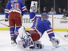 New York Rangers goalie Henrik Lundqvist loses his balance while defending the goal during the first period of the NHL hockey game against the Ottawa Senators, Sunday, Nov. 19, 2017, in New York. (AP Photo/Seth Wenig)