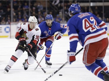 Ottawa Senators' Ryan Dzingel, left, brings the puck downice during the first period of the NHL hockey game against the New York Rangers, Sunday, Nov. 19, 2017, in New York. (AP Photo/Seth Wenig)