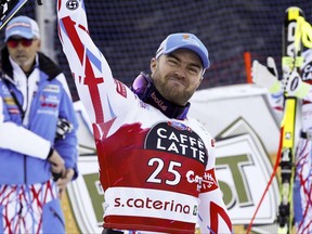In this Tuesday, Dec. 29, 2015 file photo, France's David Poisson celebrates his third-place finish in a World Cup men's in Santa Caterina Valfurva, Italy.