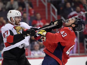 Ottawa Senators defenceman Ben Harpur swings his stick at Washington Capitals right winger Tom Wilson on Nov. 22, 2017