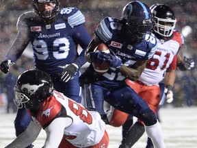 Toronto Argonauts defensive back Cassius Vaughn (26) recovers the football on a fumble by Calgary Stampeders slotback Kamar Jorden (88) during second half CFL football action in the 105th Grey Cup on Sunday, November 26, 2017 in Ottawa.