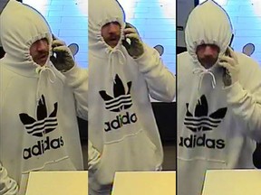 Police are hunting for a bank robber described as a Caucasian male, approximately 5'8" to 5'10" (173 cm to 178 cm) in height. It is believed he is in his mid-twenties and has a fair complexion. He was last seen with light coloured facial hair, possibly red in colour. He looks like a giant condom in this photo.