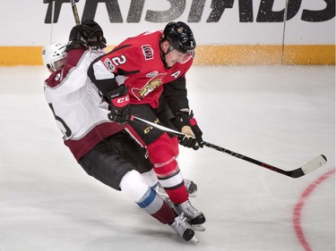 The Colorado Avalanche's Matt Nieto is flattened by the Ottawa Senators' Dion Phaneuf.