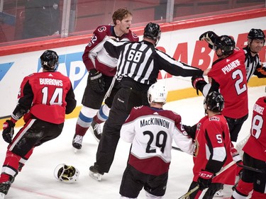 The Colorado Avalanche's Gabriel Landeskog, left, and the Ottawa Senators' Dion Phaneuf have a disagreement.