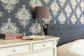 This damask wallpaper is a bold choice for a bedroom and an effective way to add an element of pattern to your home.