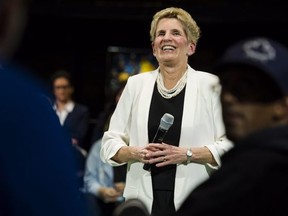 Premier Kathleen Wynne addresses questions from the public during a town hall meeting in Toronto on Monday, November 20, 2017. THE CANADIAN PRESS/Christopher Katsarov