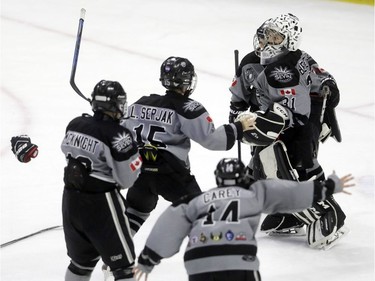 Silver Seven players celebrate after clinching victory against Syracuse.