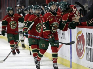 Eastern Ontario's Carey Terrance celebrates his goal against the Providence Capitals with teammates. The Wild won 3-2.