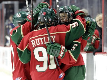 Eastern Ontario's Carey Terrance celebrates with teammates after scoring against the Providence Capitals in the major peewee AAA championship game of the 19th annual.