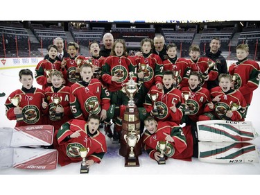 The Eastern Ontario Wild celebrate their title in the major peewee AAA championship game against the Providence Capitals at Canadian Tire Centre on Sunday.