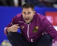 John Morris makes a call during a draw against Team Jacobs at the Roar of the Rings on Saturday.
(THE CANADIAN PRESS)