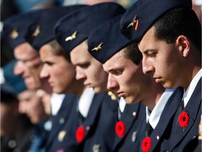 Servicemen wear poppies during a commemoration ceremony to mark the 100th anniversary of the Battle of Vimy Ridge, a World War I battle which was a costly victory for Canada, but one that helped shape the former British colony's national identity.