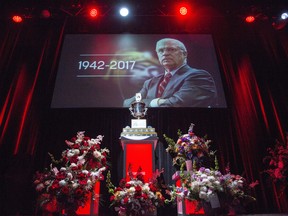 The Jack Adams Award, which Bryan Murray won in 1984, sits among flowers during a celebration of life service for former Ottawa Senators general manager and coach, Bryan Murray, at the Canadian Tire Centre Thursday, August 24, 2017