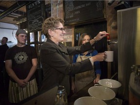 Ontario Premier Kathleen Wynne makes herself a cup of tea at a Toronto coffee shop, before making an announcement regarding the minimum wage in the province, on Thursday, January 30, 2014. The debates are always the same, says a letter writer.