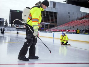 Crews were hard at work on Sunday, continuing to prepare the ice for the 2017 Scotiabank NHL 100 Classic at Lansdowne Park on Saturday.   Ashley Fraser/Postmedia