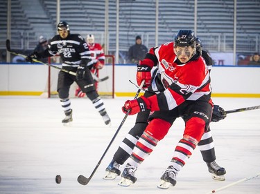 Ottawa 67's #27 Carter Robertson brings the puck down the ice during the outdoor game against the Gatineau Olympiques at TD Place Sunday December 17, 2017.   Ashley Fraser/Postmedia