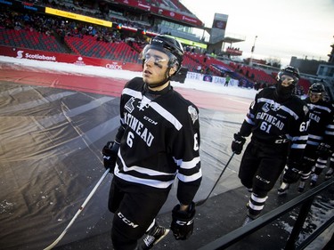 Gatineau Olympiques Mathieu Charlebois makes his way to the ice for the outdoor game against the Ottawa 67's at TD Place Sunday December 17, 2017.   Ashley Fraser/Postmedia
