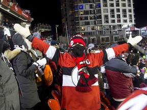 Fans react to the Ottawa Senators scoring against the Montreal Canadiens during the NHL 100 Classic in Ottawa on Saturday December 16, 2017 at TD Place.   Ashley Fraser/Postmedia