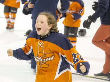 Kanata's William Robinson reacts after his team's shootout victory in the Minor Atom A final.   Ashley Fraser/Postmedia