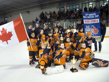 The Kanata Blazers have their photo taken to commemorate Saturday's victory against the St. Clair Shores Saints in the Minor Atom A final at Minto Arena.    Ashley Fraser/Postmedia