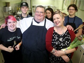 Chef Bruce Wood (centre) and at-risk youth make tourtières to sell as part of FoodWorks, a social enterprise that engages at-risk youth in Ottawa in the development of culinary skills. They include (from left): youths Ellie Watts, 22, Sean Hartman, 18, Christine Carroll, 25, Foodworks business consultant, Mandi Lunan, and Brad Tessier.