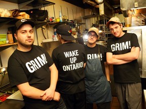 Nolan Tanner, Mike Madigan, Adam Ghor and Nick Thompson, cooks at the Black Tomato, will lose their jobs when the restaurant closes at the end of the month. Owner Peter Besserer has made up 'Wake Up Ontario' tshirts for his staff to wear.